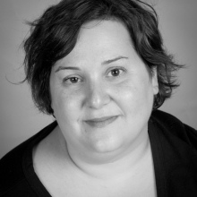 A headshot of Marni Shindelman who is wearing a black shirt.